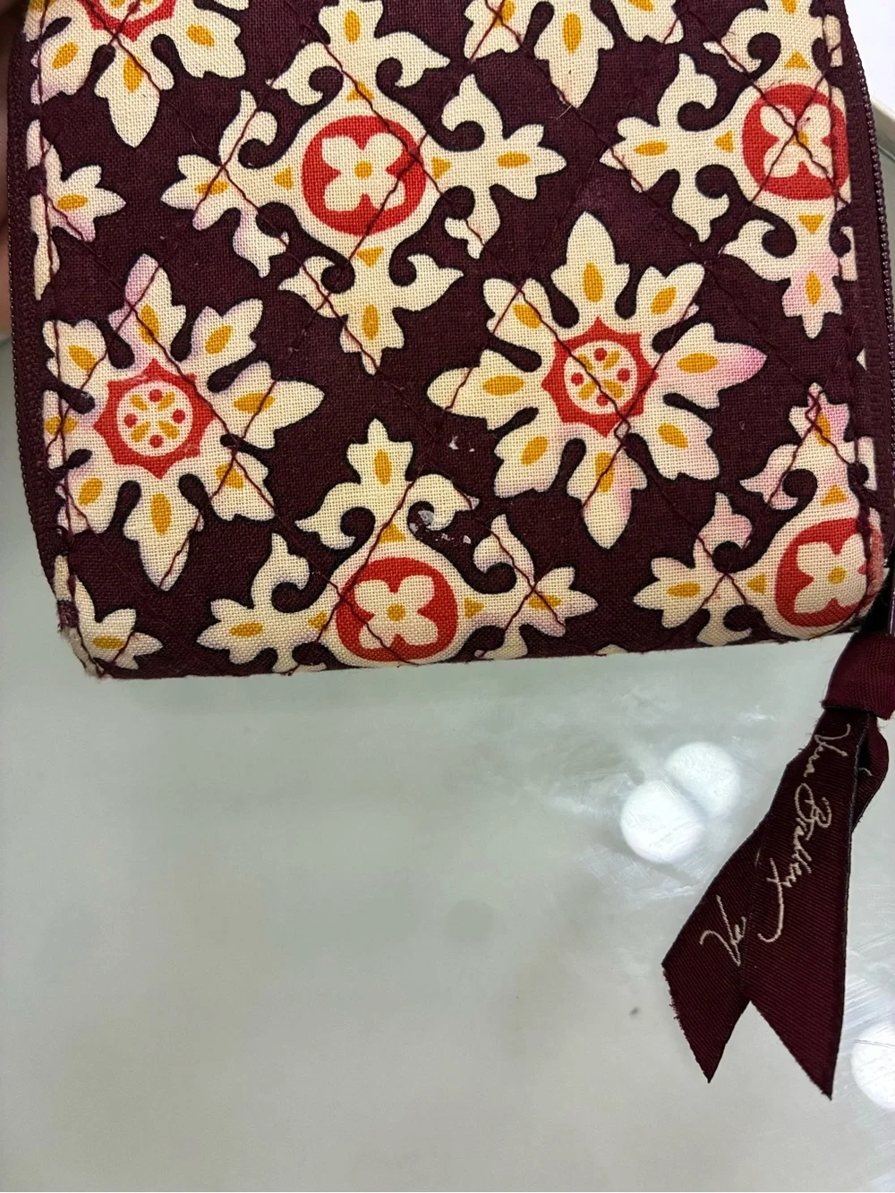 Vera Bradley Bifold Square Zip Wallet Has pink staining on back of wallet shown